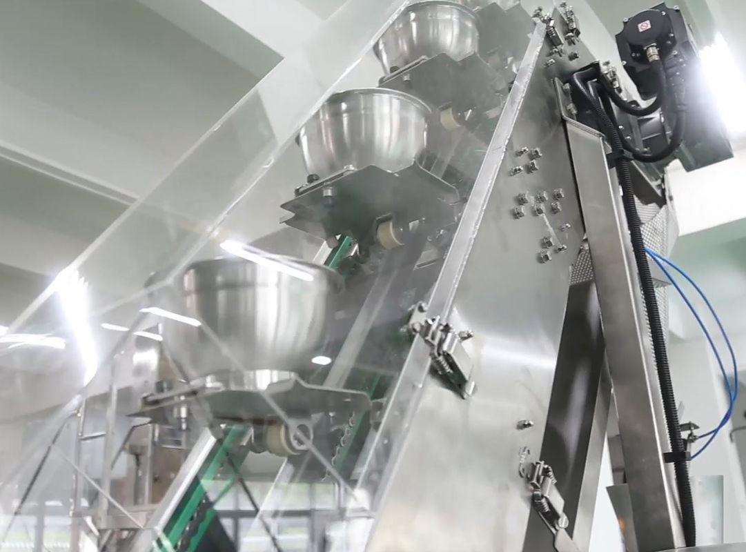 14 Weigher VFFS Mutihead ανελκυστήρας τύπων κύπελλων μηχανών συσκευασίας για τα παγωμένα φασόλι φρούτα σοκολάτας